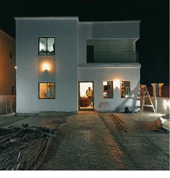 A completed Smart Brother Construction home in Liberia at dusk